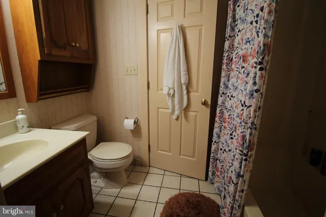 a view of a patio in the backyard