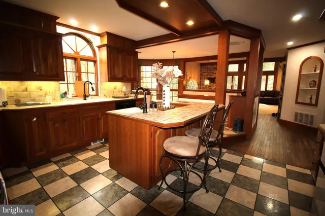 a kitchen with a sink a stove and a refrigerator
