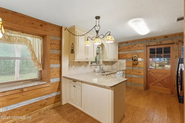 a bathroom with a sink a vanity and a mirror