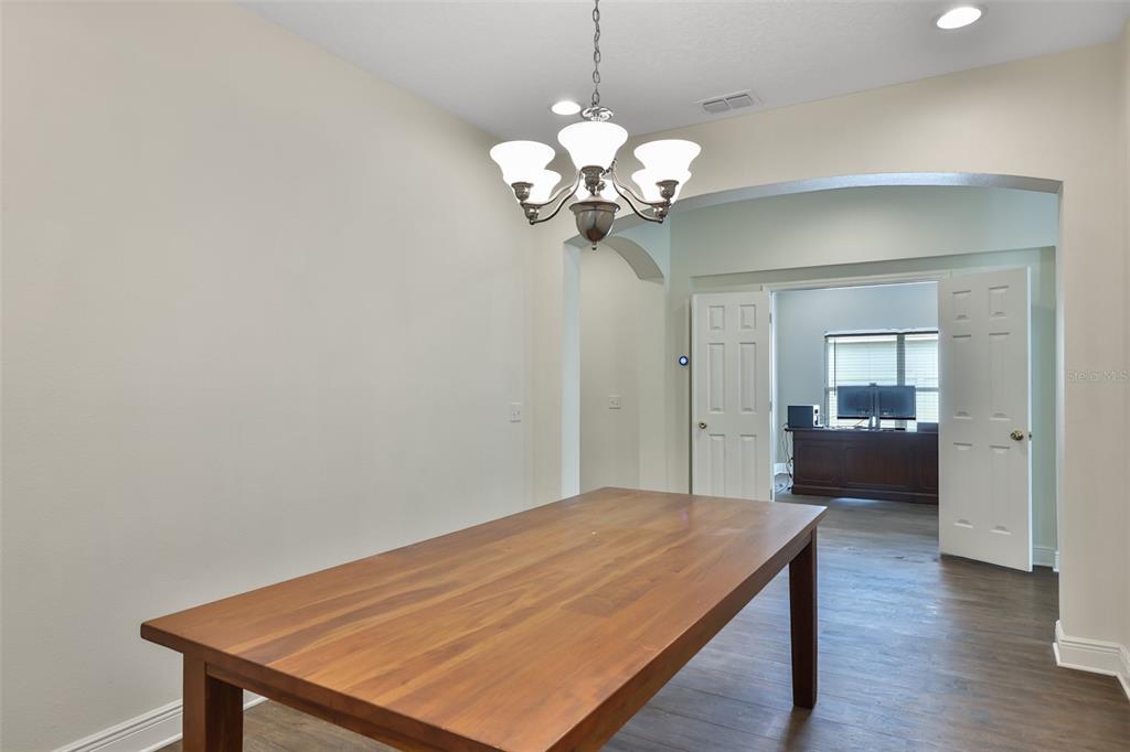 708 Coade Stone Drive Seffner, FL 33584 - Photo 6 of 48 a view of a room with a wooden floor