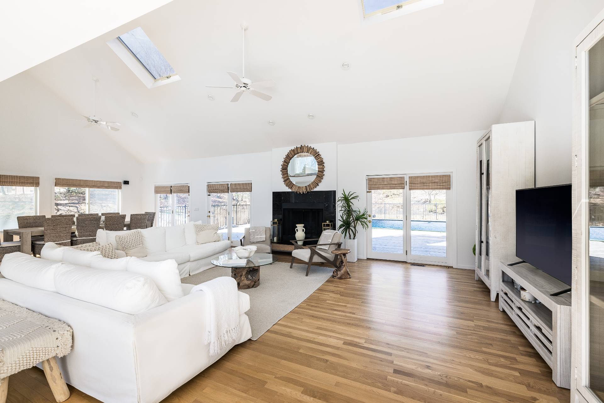 5 Wigwam View Lane East Hampton, NY 11937 - Photo 11 of 28 a living room with furniture a fireplace and a flat screen tv