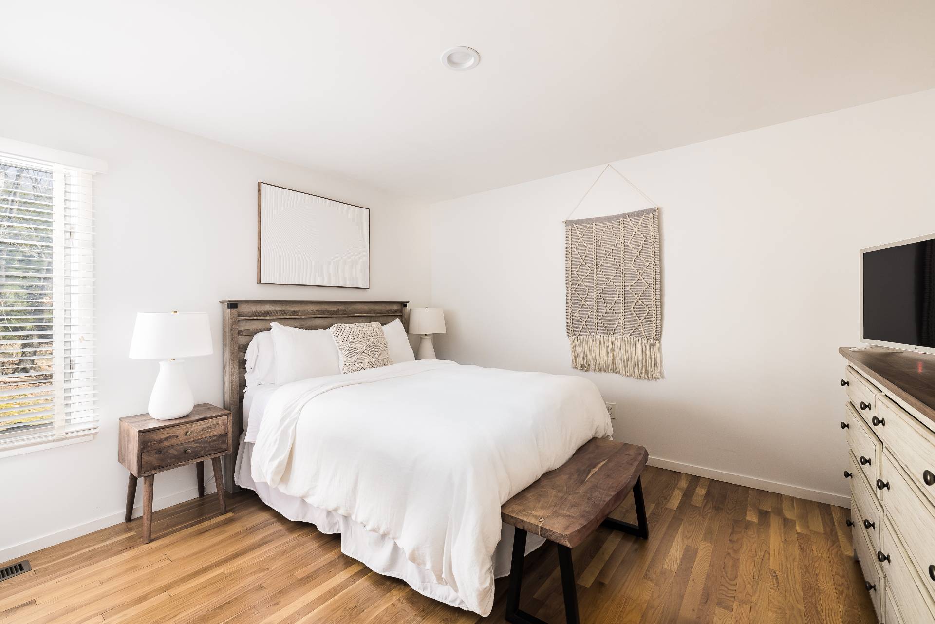 5 Wigwam View Lane East Hampton, NY 11937 - Photo 16 of 28 a bedroom with a bed and wooden floor