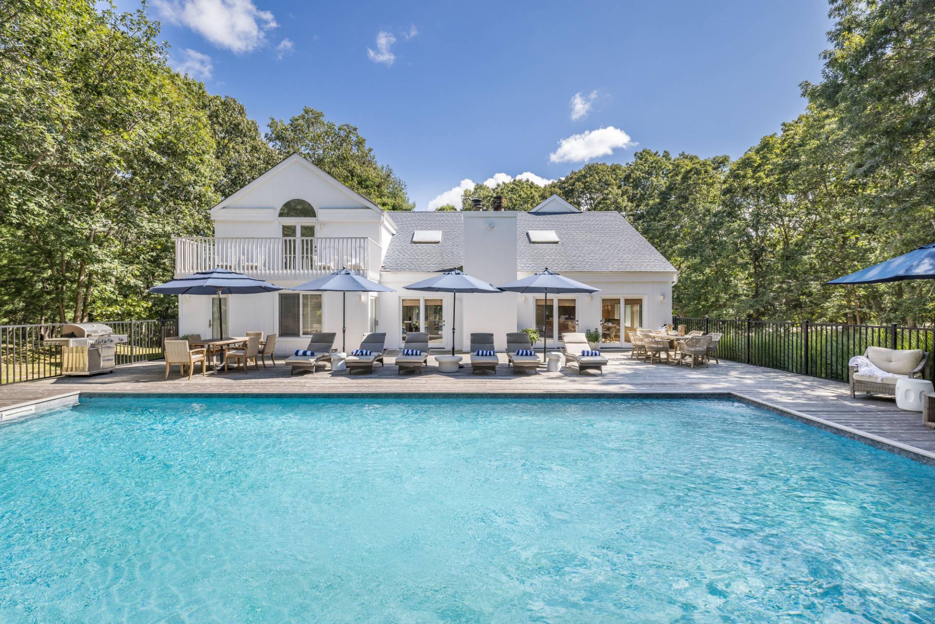 5 Wigwam View Lane East Hampton, NY 11937 - Photo 2 of 28 a front view of a house with yard and garage