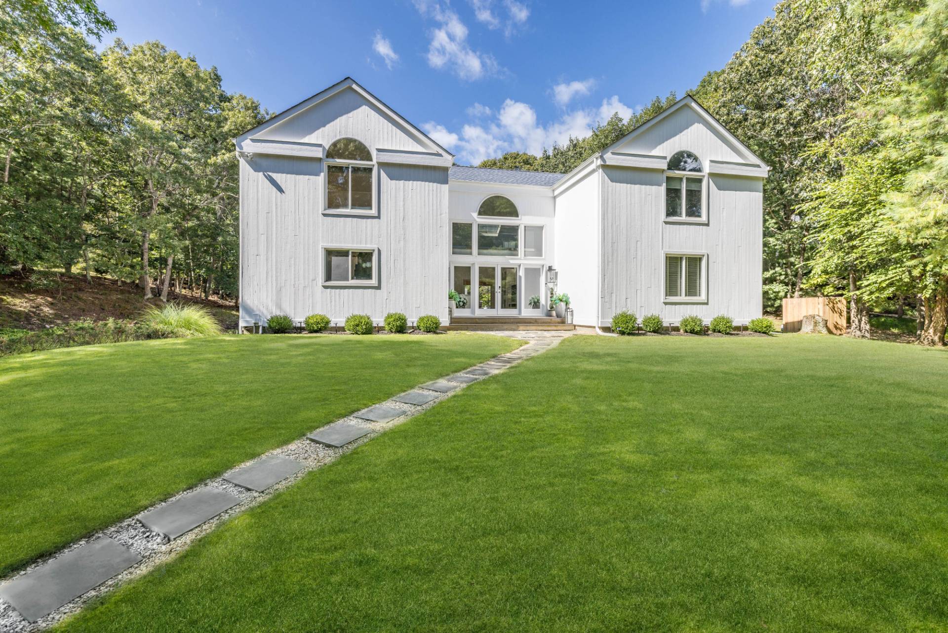 5 Wigwam View Lane East Hampton, NY 11937 - Photo 24 of 28 a front view of a house with a yard