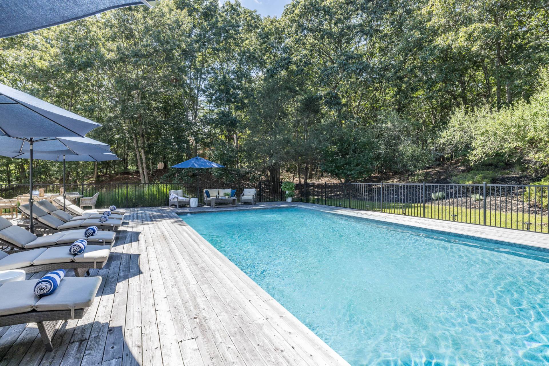 5 Wigwam View Lane East Hampton, NY 11937 - Photo 3 of 28 a view of a swimming pool with a patio
