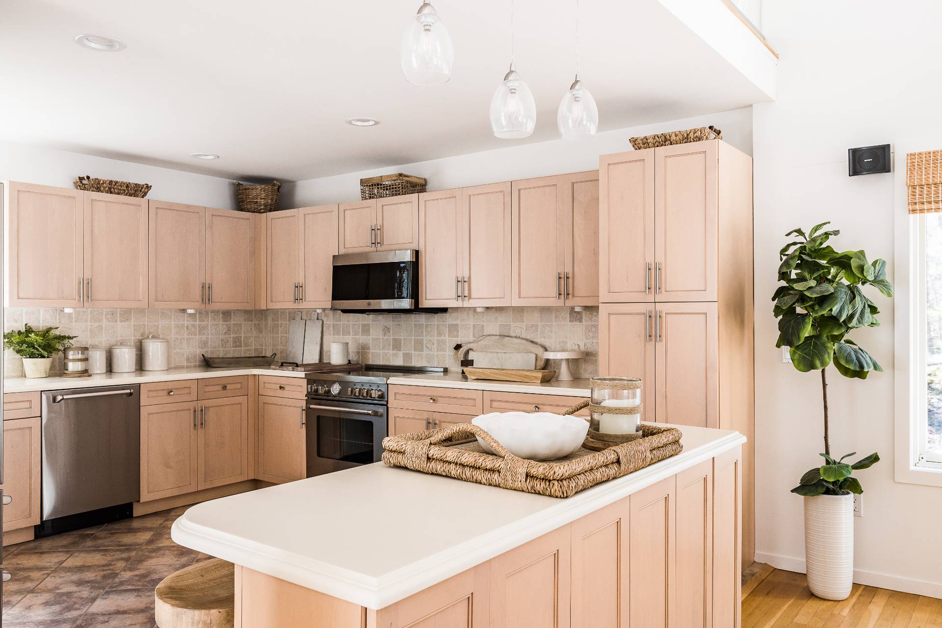 5 Wigwam View Lane East Hampton, NY 11937 - Photo 9 of 28 a kitchen with stainless steel appliances granite countertop a refrigerator a stove a sink dishwasher and white cabinets with wooden floor