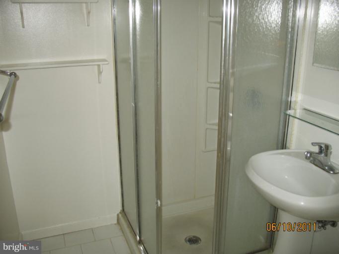 4215 Ivy Glen Road Silver Spring, MD 20906 - Photo 3 of 8 a bathroom with a sink and mirror