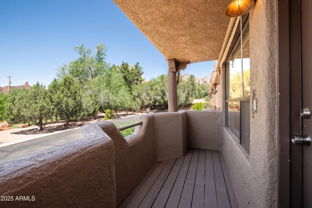 a view of a dinning table and chairs in patio