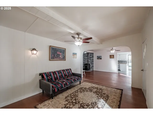 a view of a livingroom with furniture window and wooden floor