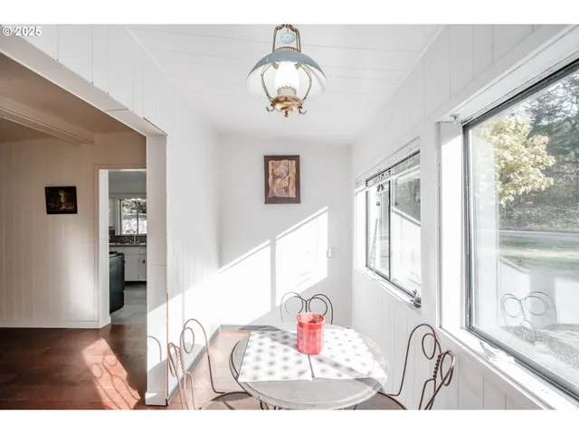 a view of a dining room with furniture window and outside view