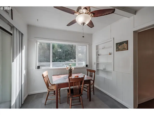 a kitchen with stainless steel appliances kitchen island granite countertop a sink stove and refrigerator