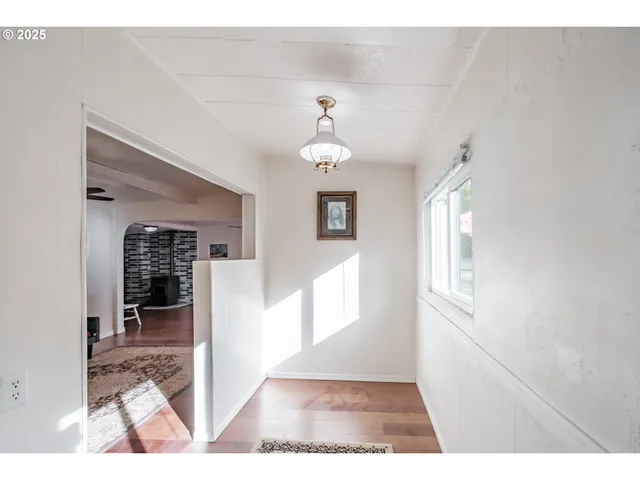 a view of a living room and workspace