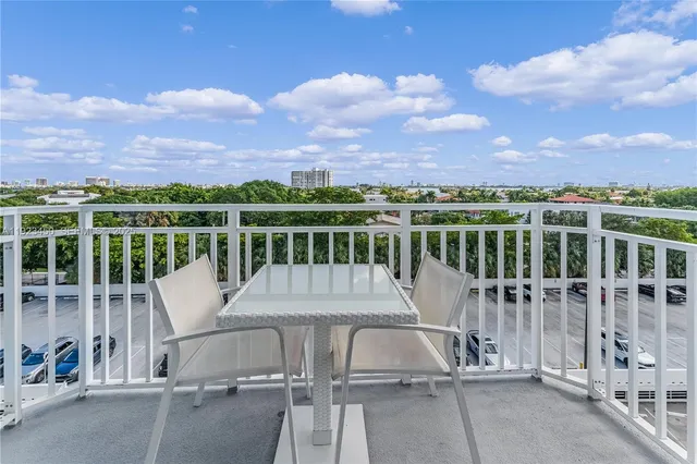 a view of a chairs and table on the terrace