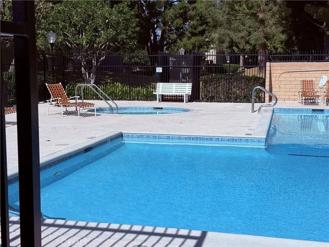 a view of a swimming pool with a patio