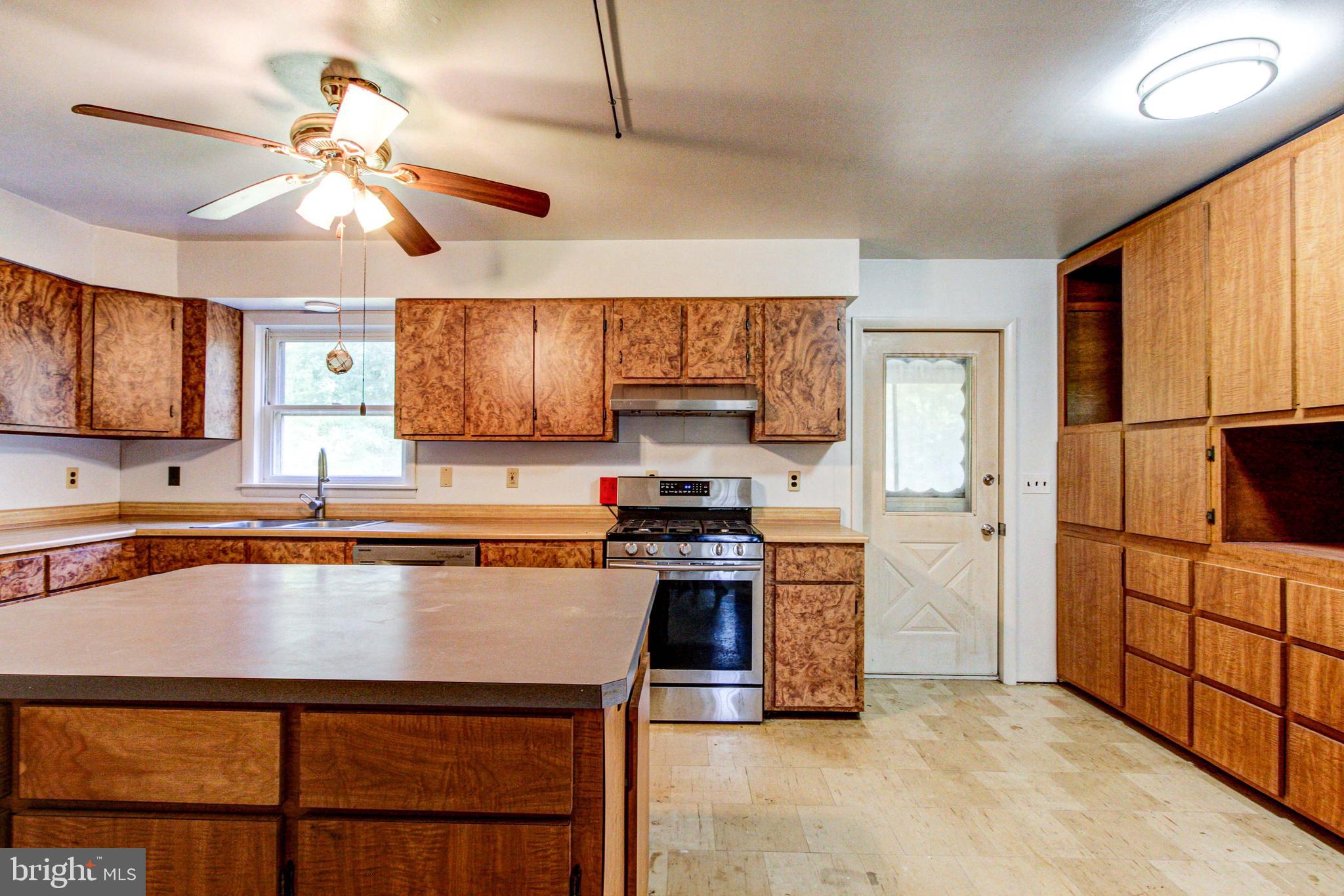 2030 Upper Ridge Road Green Lane, PA 18054 - Photo 13 of 61 a kitchen with stainless steel appliances granite countertop a stove refrigerator sink and microwave
