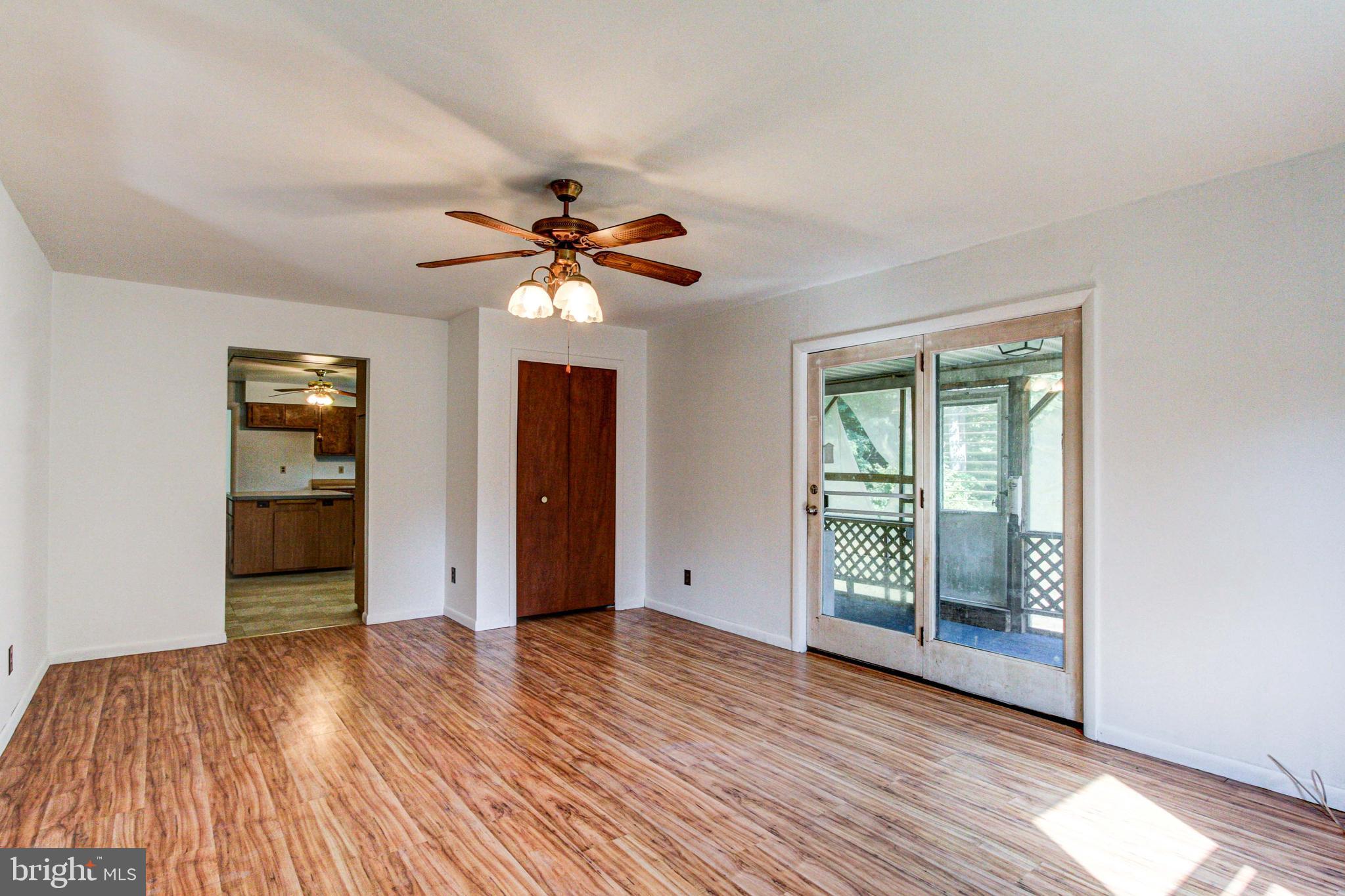 2030 Upper Ridge Road Green Lane, PA 18054 - Photo 20 of 61 a view of an empty room with window and wooden floor