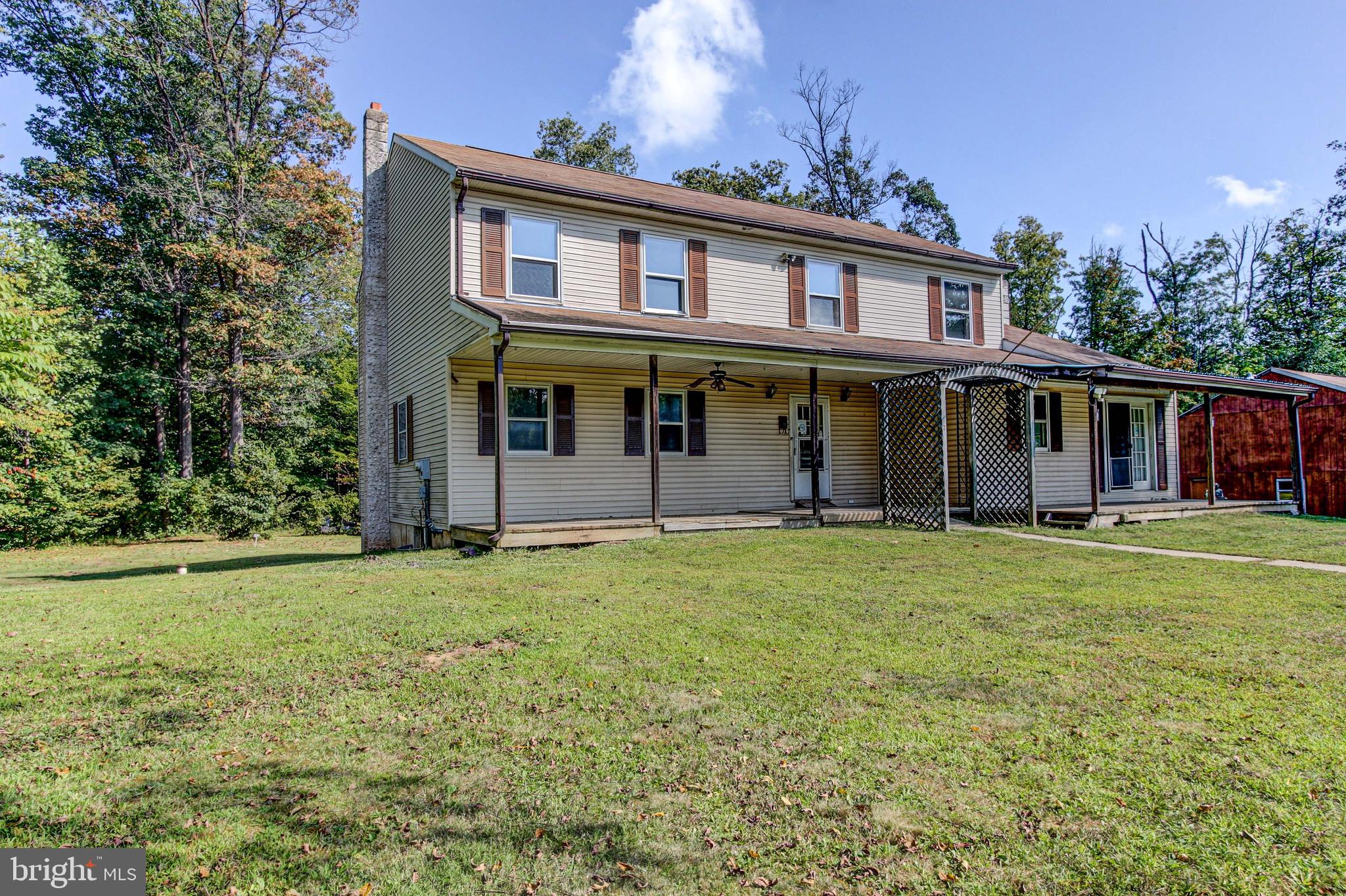 2030 Upper Ridge Road Green Lane, PA 18054 - Photo 2 of 61 front view of a house with a garden