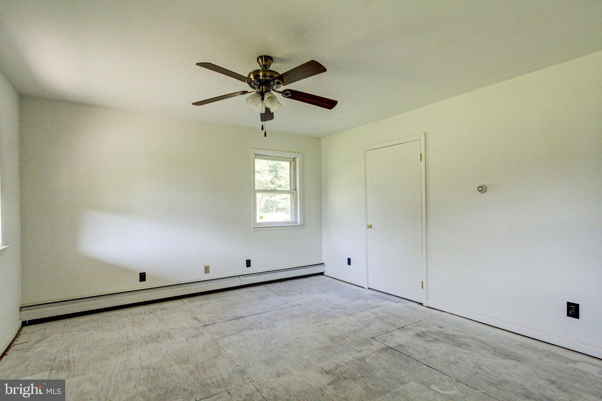 2030 Upper Ridge Road Green Lane, PA 18054 - Photo 21 of 61 an empty room with windows and fan view