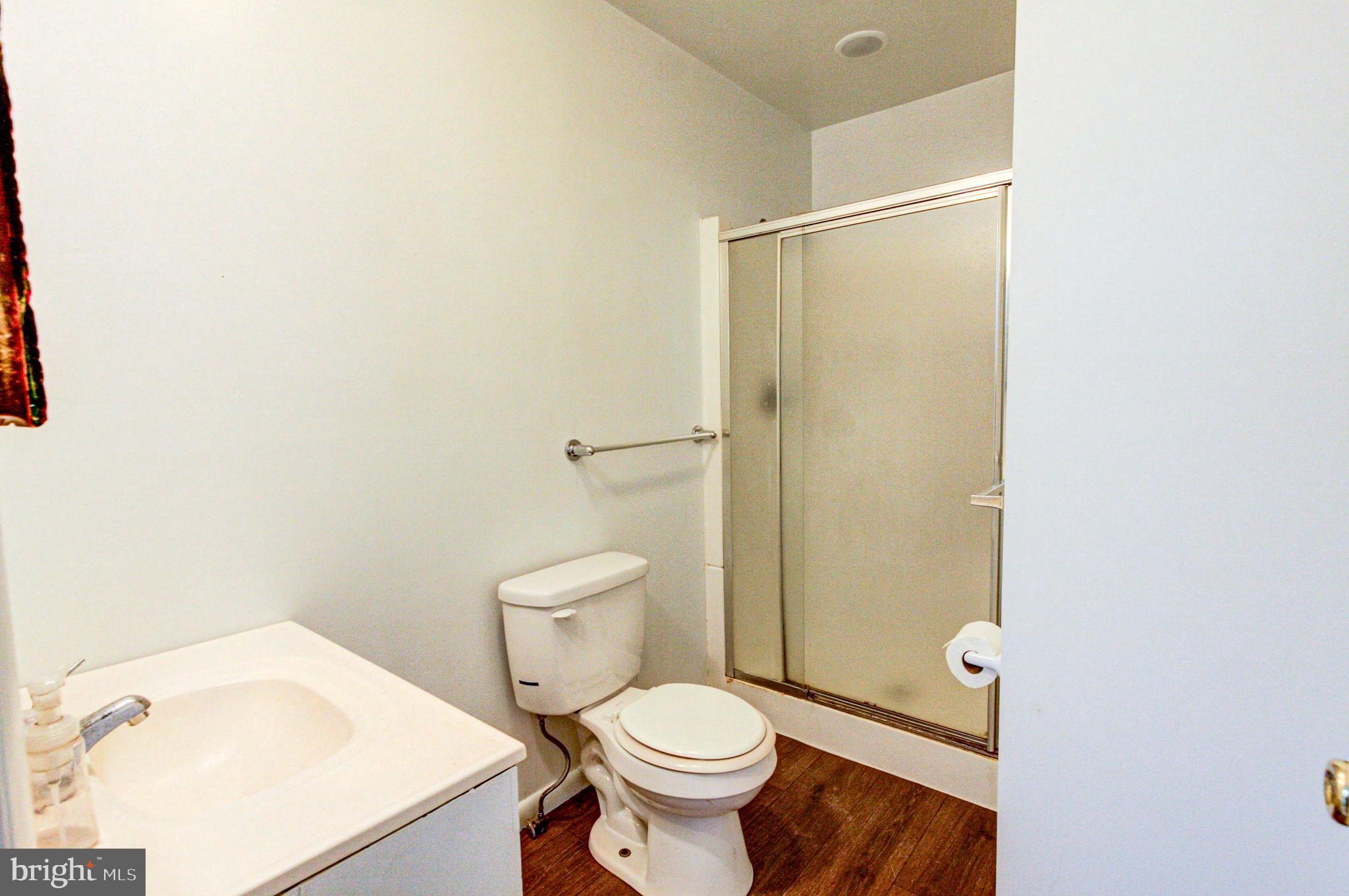 2030 Upper Ridge Road Green Lane, PA 18054 - Photo 29 of 61 a white toilet sitting next to a bathroom sink