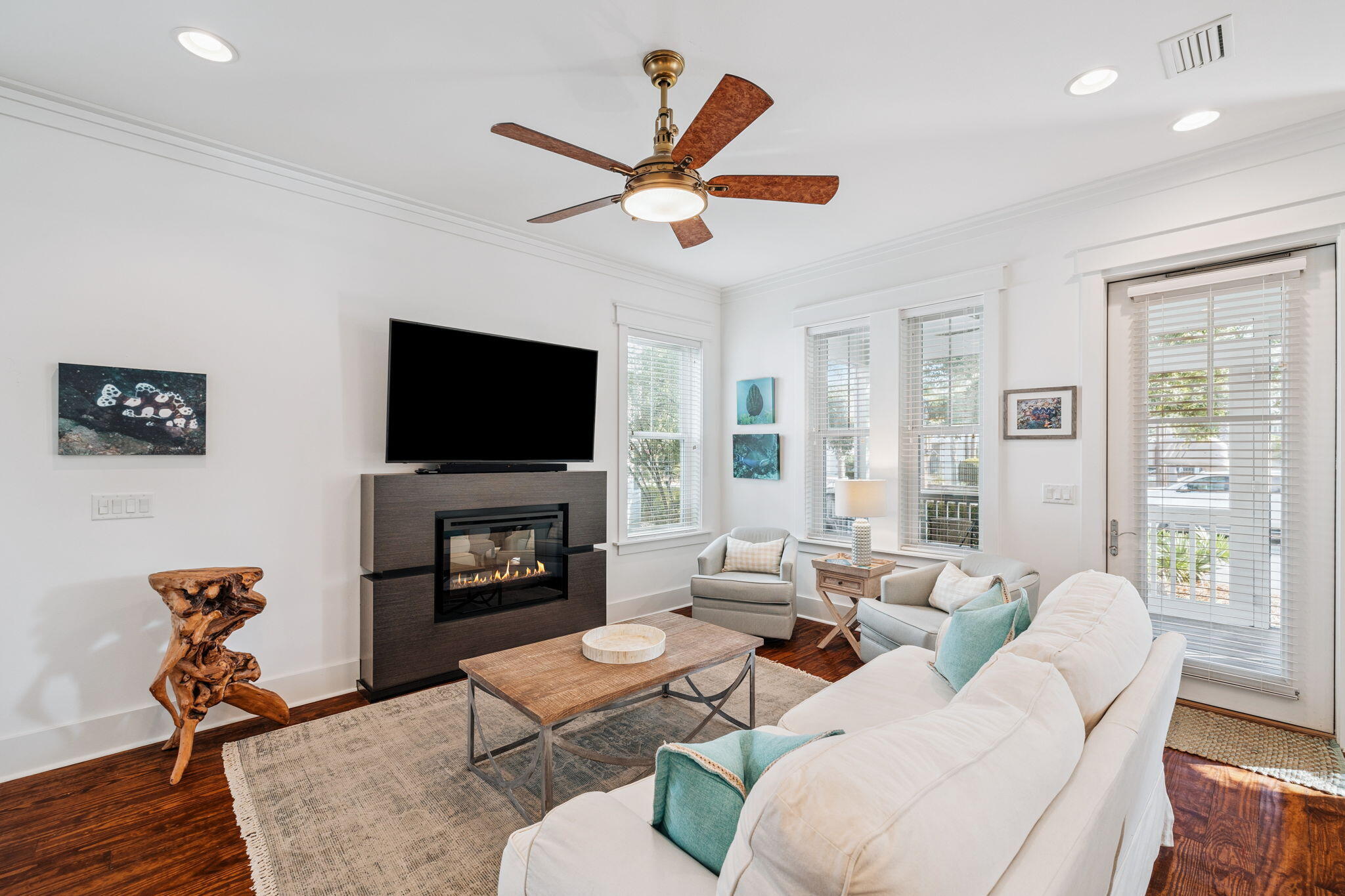 844 Sandgrass Boulevard Santa Rosa Beach, FL 32459 - Photo 12 of 74 a living room with furniture a fireplace and a flat screen tv