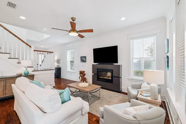 a kitchen with granite countertop white cabinets and stainless steel appliances