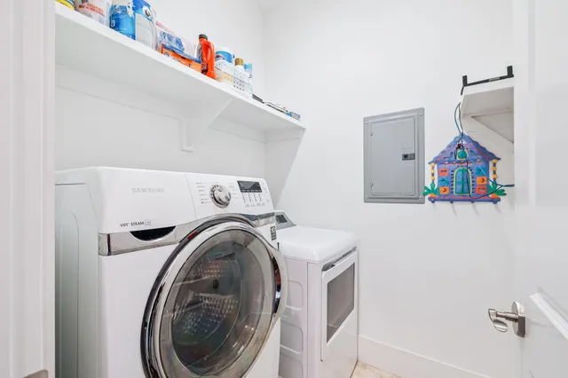 a white toilet sitting next to a bathroom sink