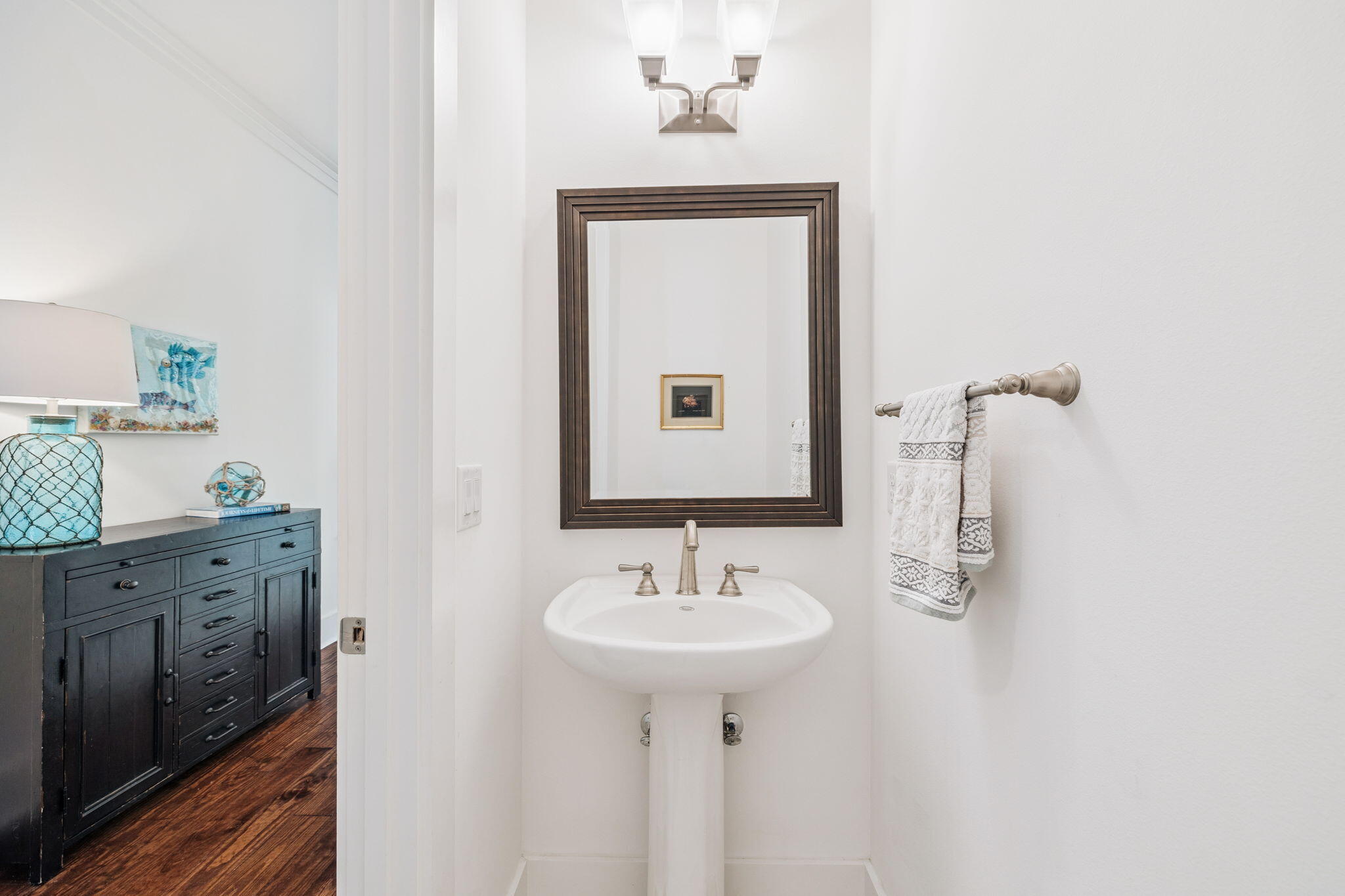 844 Sandgrass Boulevard Santa Rosa Beach, FL 32459 - Photo 35 of 74 a bathroom with a sink and a mirror
