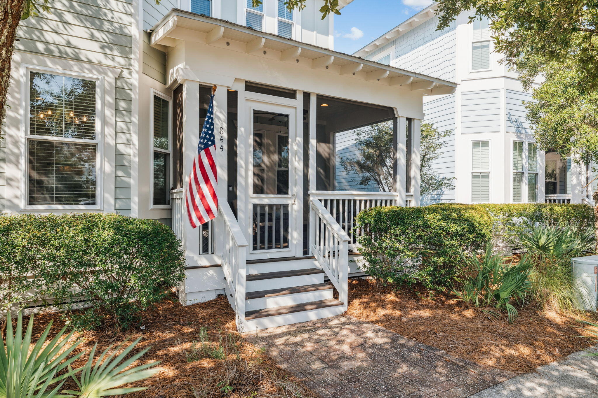 844 Sandgrass Boulevard Santa Rosa Beach, FL 32459 - Photo 4 of 74 a front view of a house with a yard table and chairs