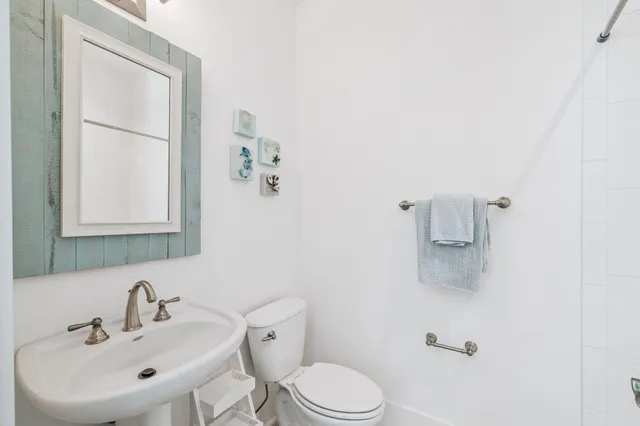 a front view of a house with a yard and fountain