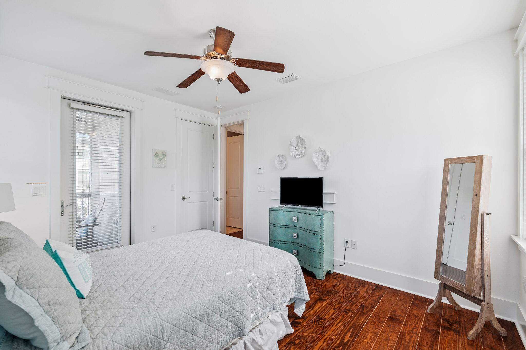 844 Sandgrass Boulevard Santa Rosa Beach, FL 32459 - Photo 48 of 74 a bedroom with a bed and a flat screen tv
