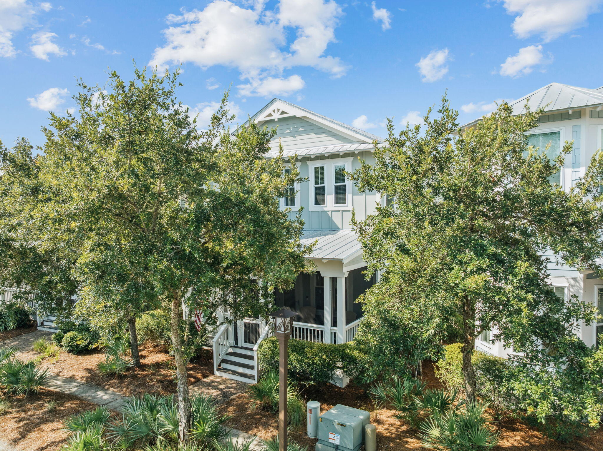 844 Sandgrass Boulevard Santa Rosa Beach, FL 32459 - Photo 65 of 74 a front view of a house with a yard and fountain