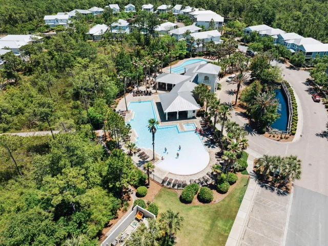 a living room with furniture a lamp and a chandelier