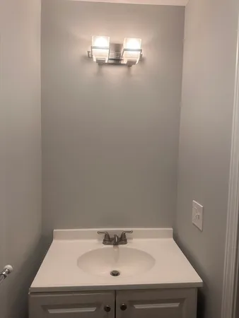 a bathroom with a sink and mirror