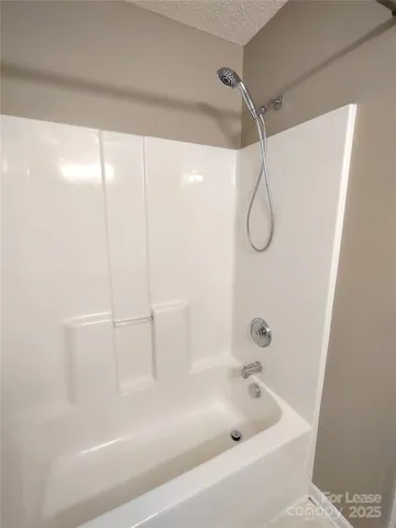 a close view of a bathtub in bathroom