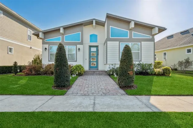 a front view of a house with garden