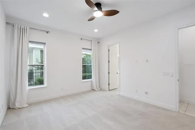 an empty room with windows and entrance