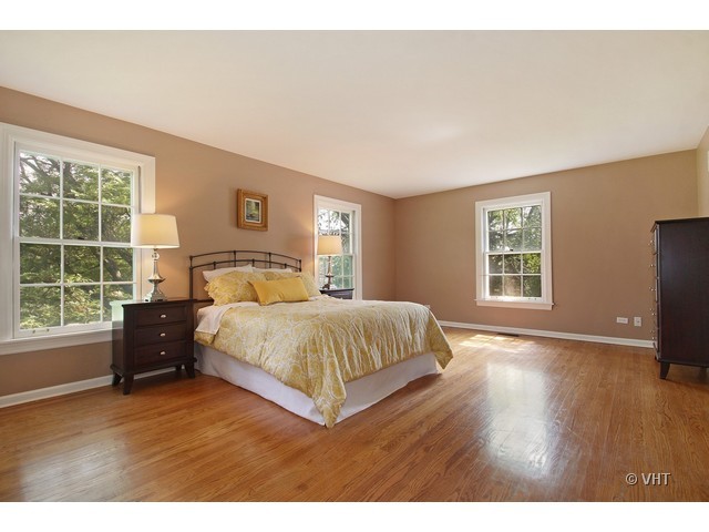 1742 Appleby Road Inverness, IL 60067 - Photo 11 of 25 a bedroom with a bed and a large window