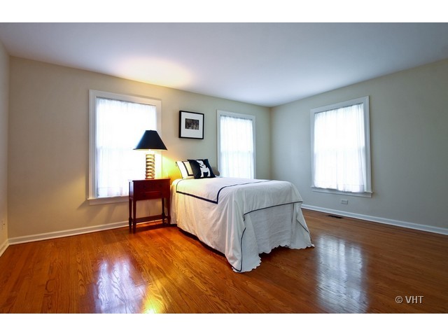 1742 Appleby Road Inverness, IL 60067 - Photo 14 of 25 a bedroom with a bed and a table