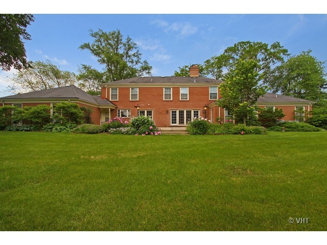 1742 Appleby Road Inverness, IL 60067 - Photo 22 of 25 a front view of a house with a garden