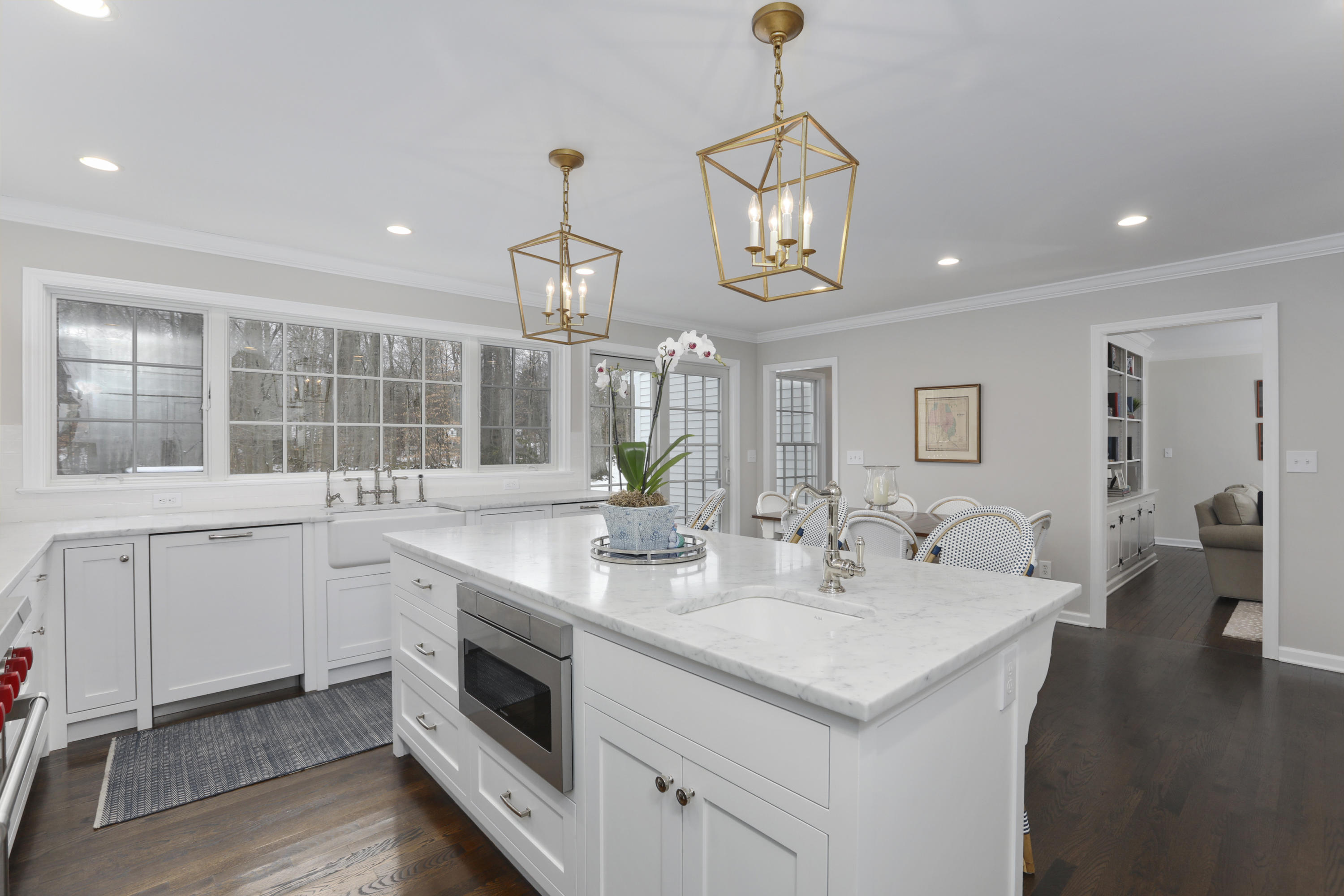 27 Deepwood Road Darien, CT 06820 - Photo 14 of 48 a kitchen with sink stove and wooden floor