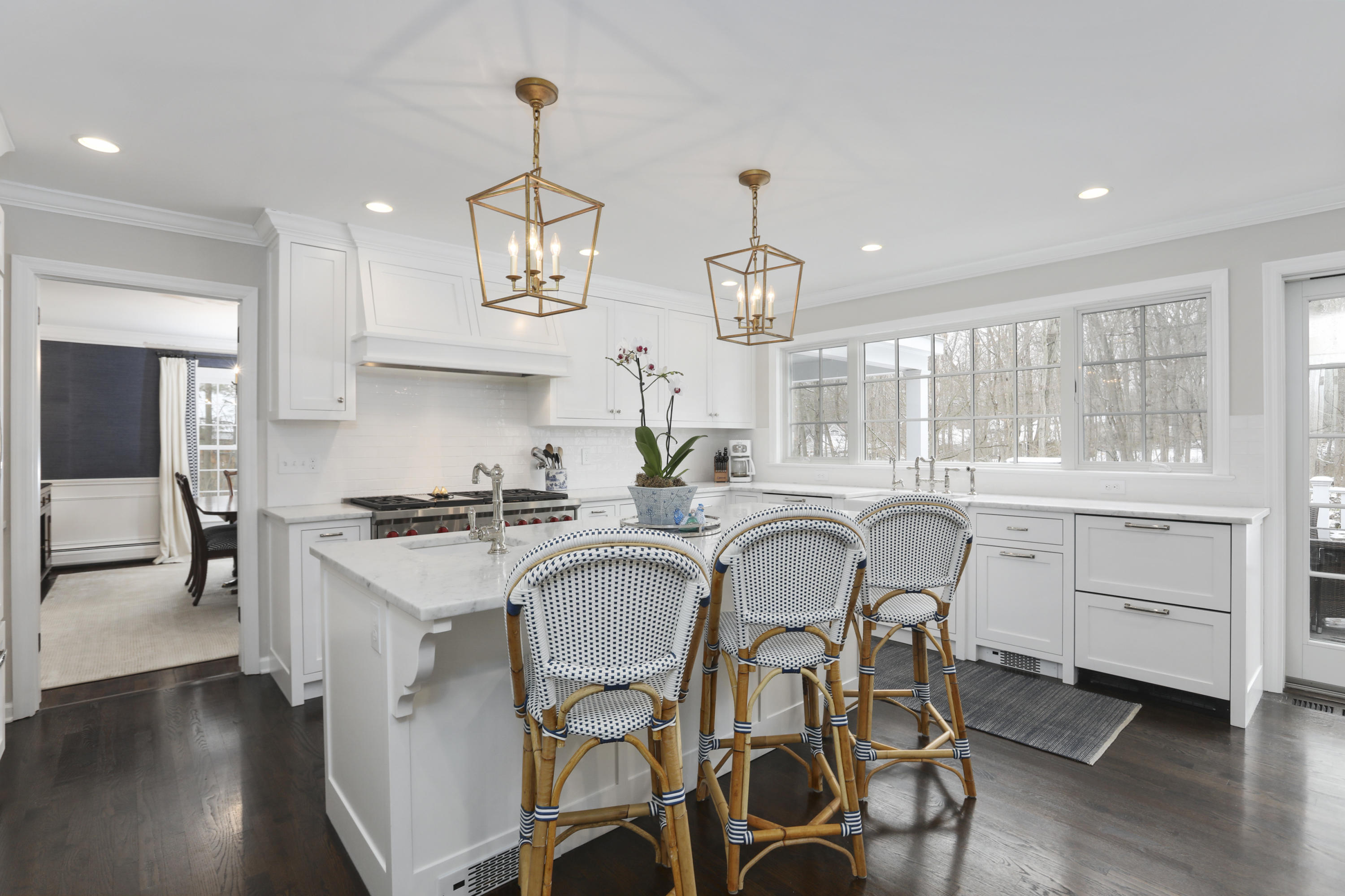 27 Deepwood Road Darien, CT 06820 - Photo 17 of 48 a kitchen with a sink stove and cabinets