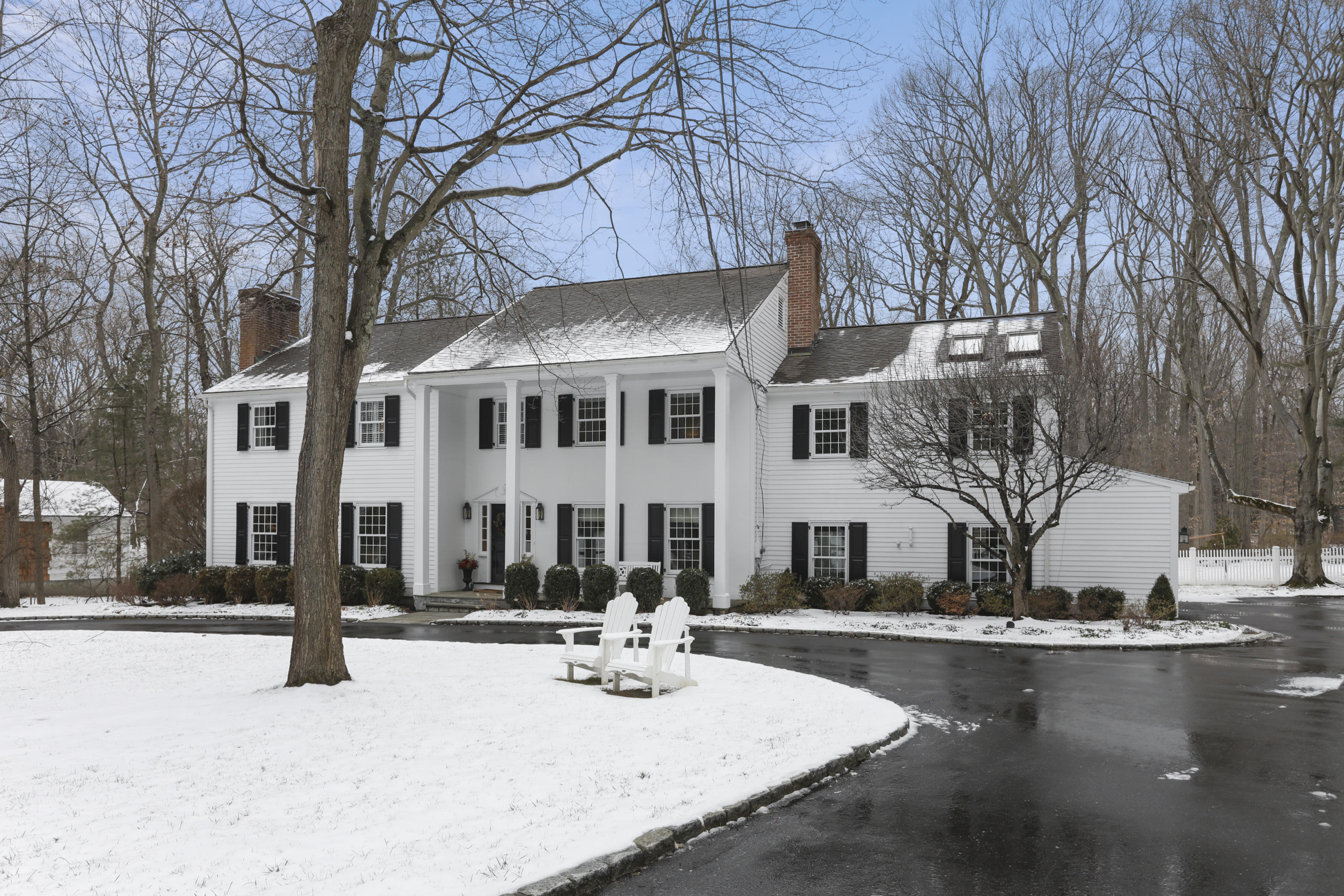27 Deepwood Road Darien, CT 06820 - Photo 3 of 48 a view of a building with snow on the road