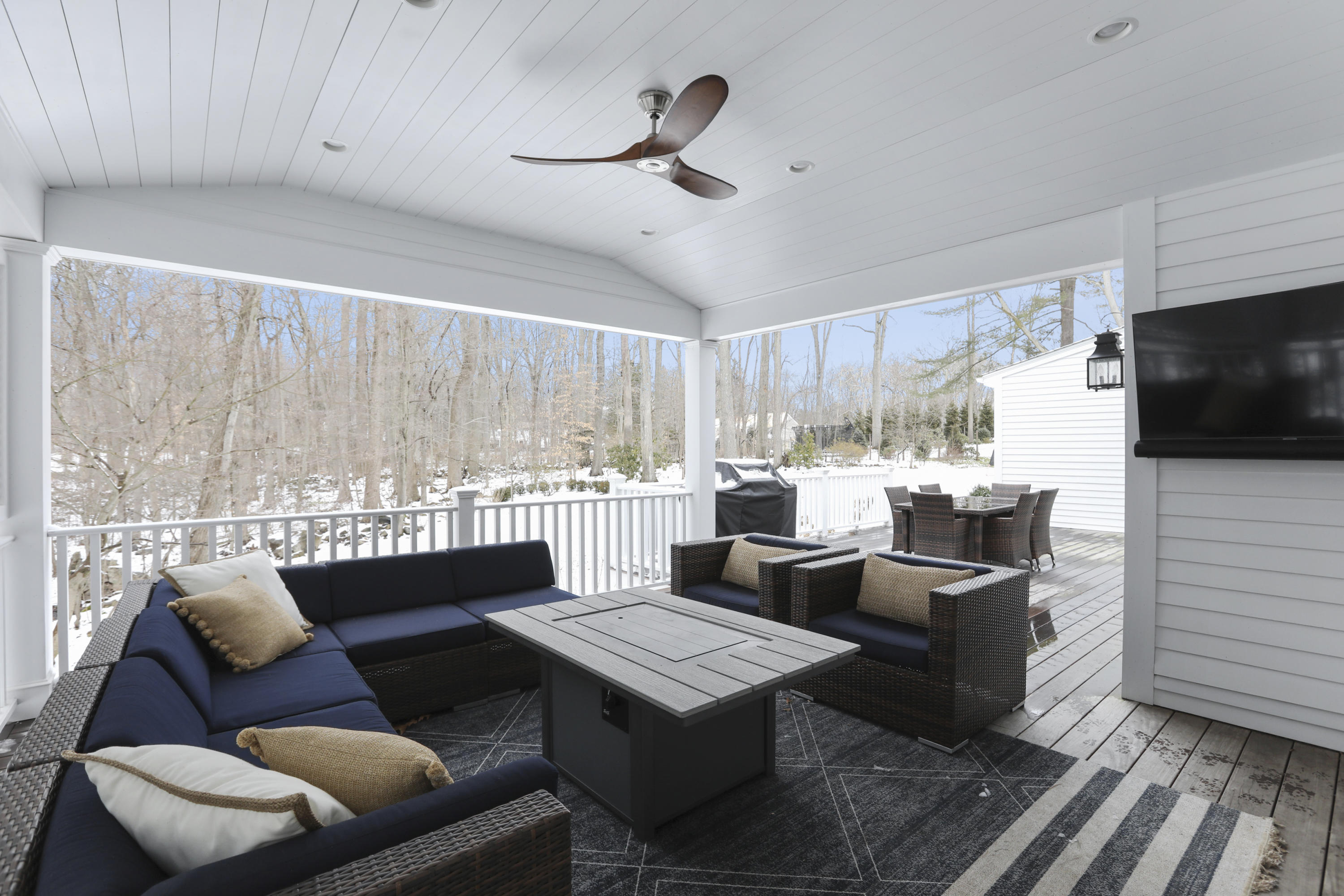 27 Deepwood Road Darien, CT 06820 - Photo 21 of 48 a living room with couches and kitchen view with wooden floor