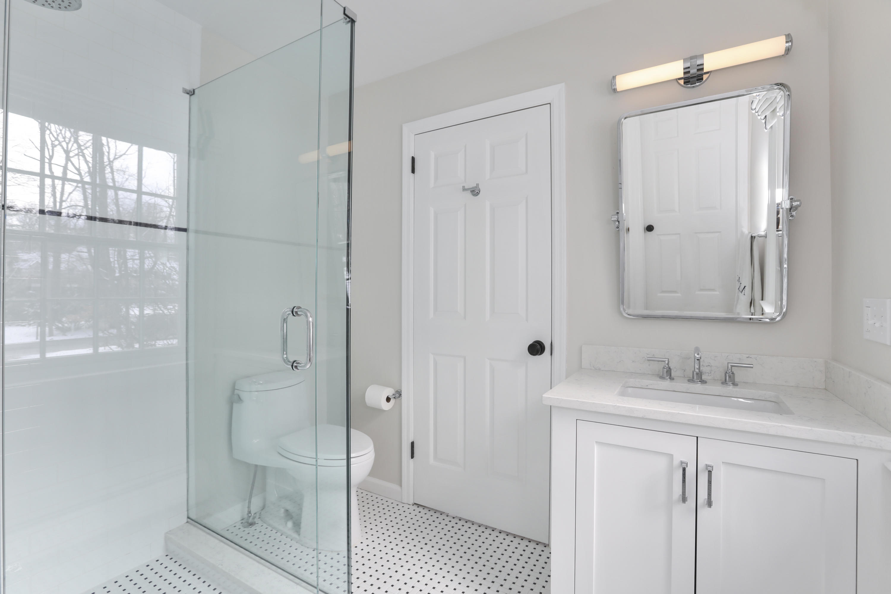 27 Deepwood Road Darien, CT 06820 - Photo 40 of 48 a bathroom with a shower sink and mirror