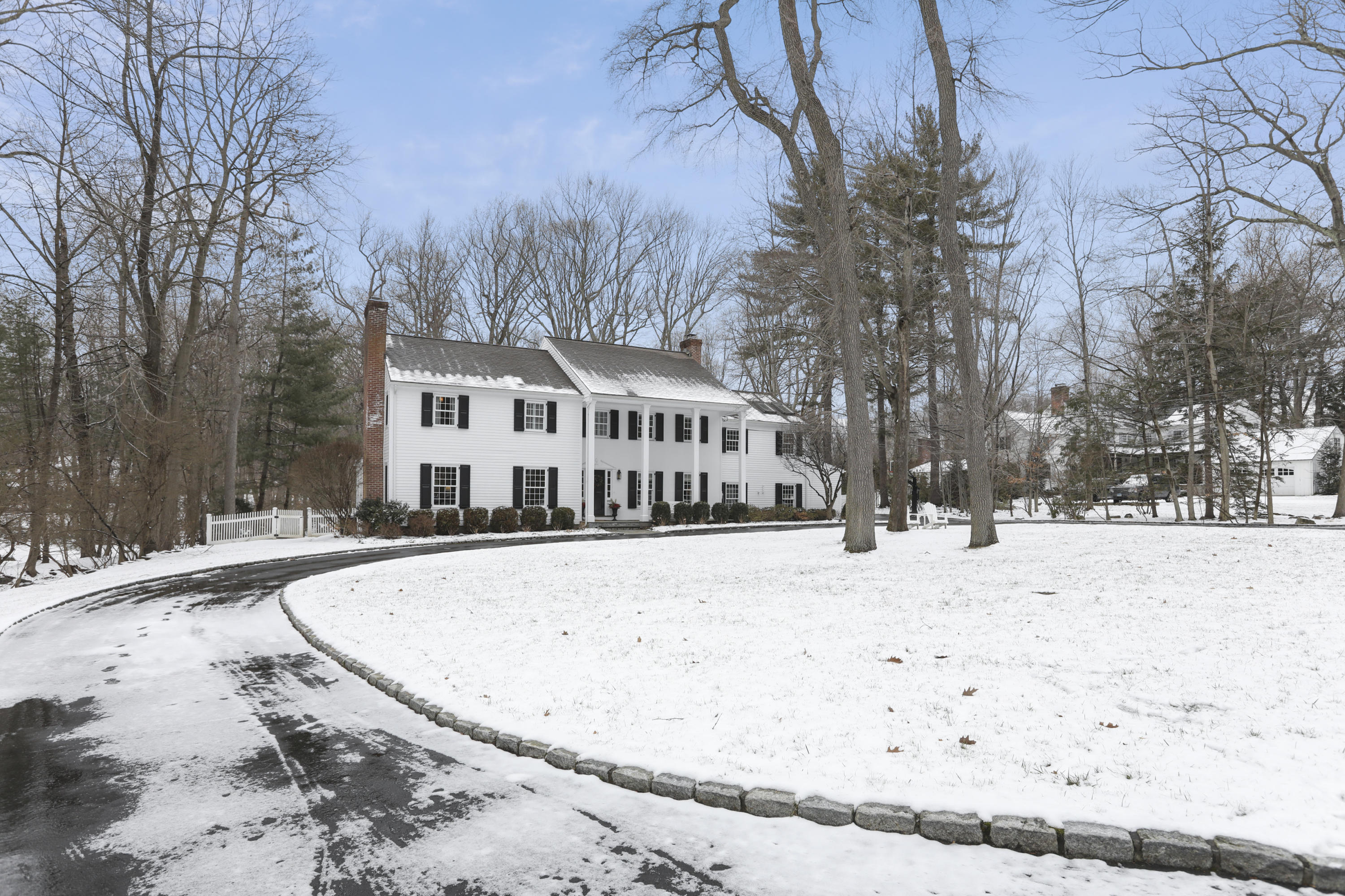 27 Deepwood Road Darien, CT 06820 - Photo 5 of 48 a view of a house with snow on the yard