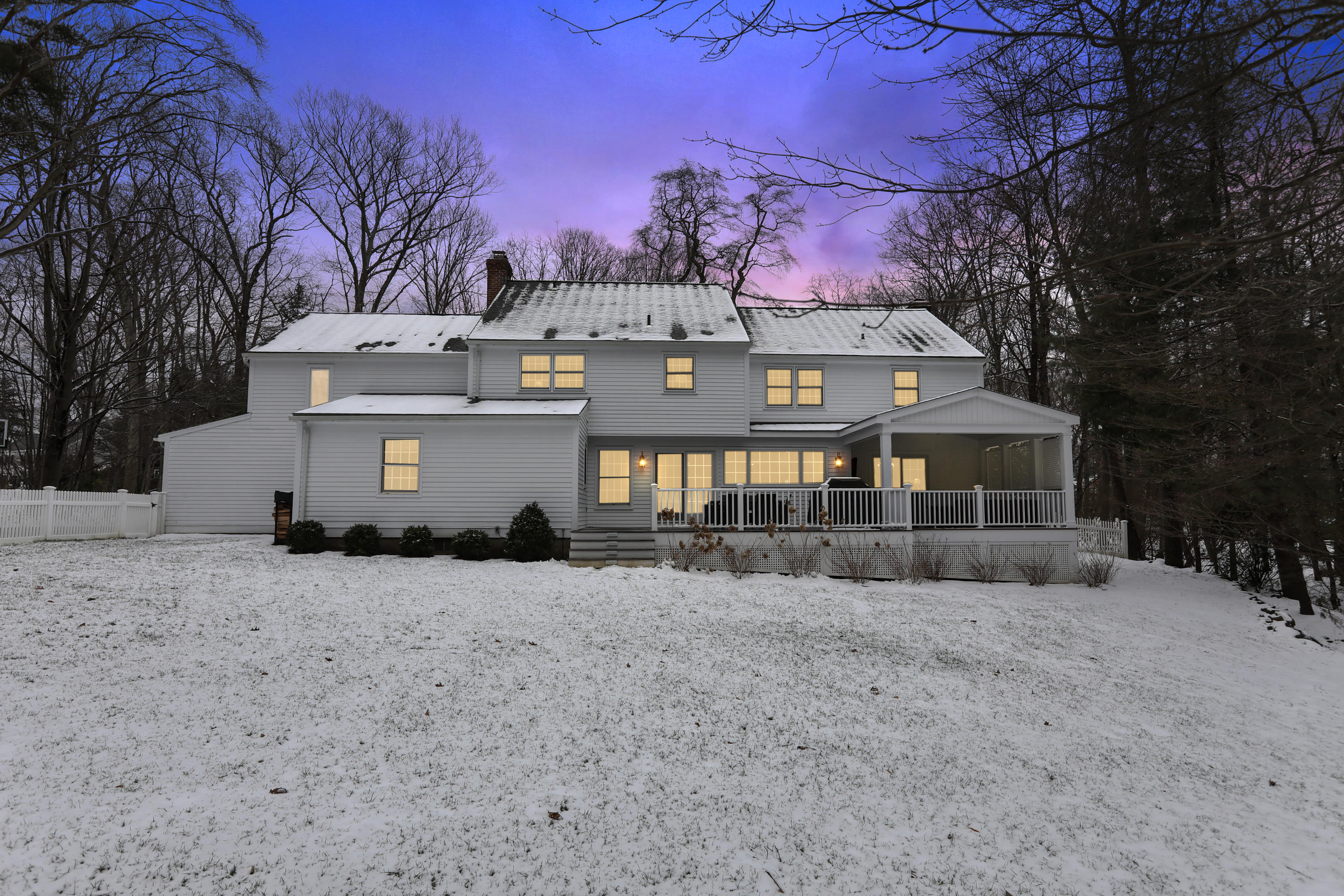 27 Deepwood Road Darien, CT 06820 - Photo 46 of 48 a front view of a house with a yard and garage
