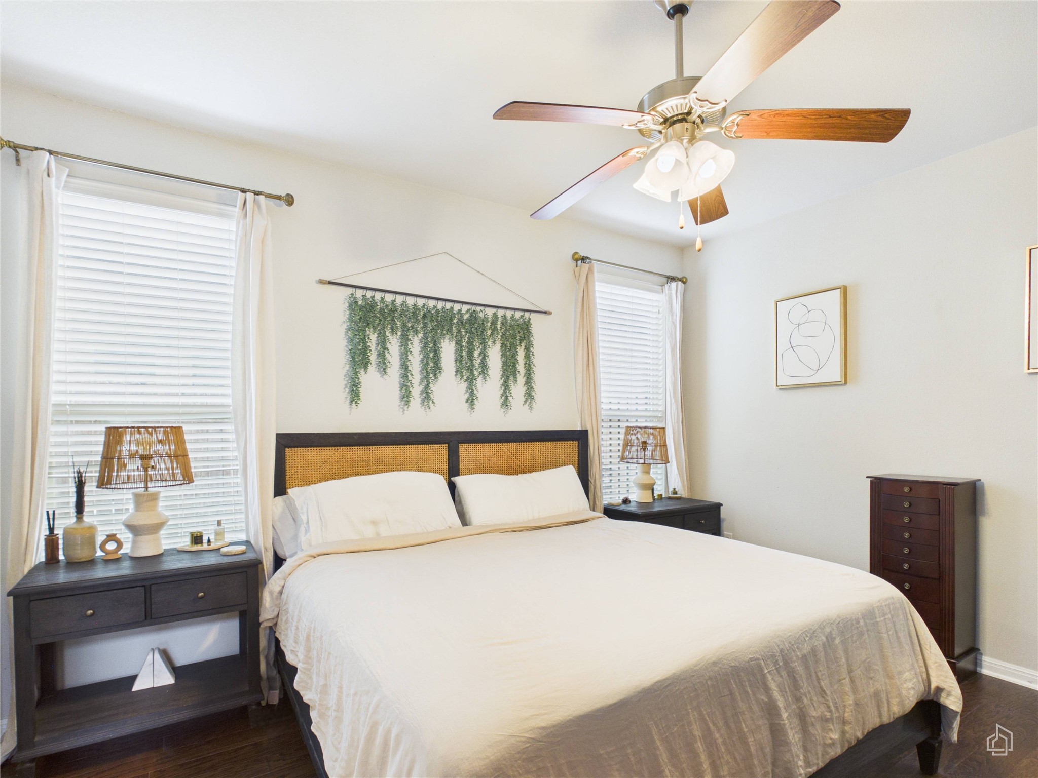 9310 Tanager Way Austin, TX 78748 - Photo 8 of 32 Well-lit sleeping quarters with rich hardwood flooring and ceiling fan for comfort.