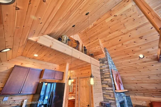 a bathroom with a granite countertop shower a sink and a mirror