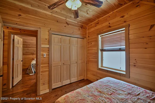 a bedroom with a bed and a table