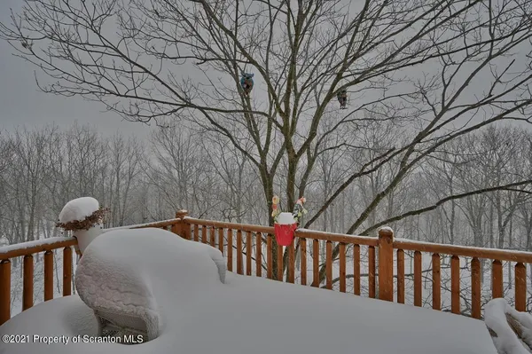 a view of balcony with table and chairs